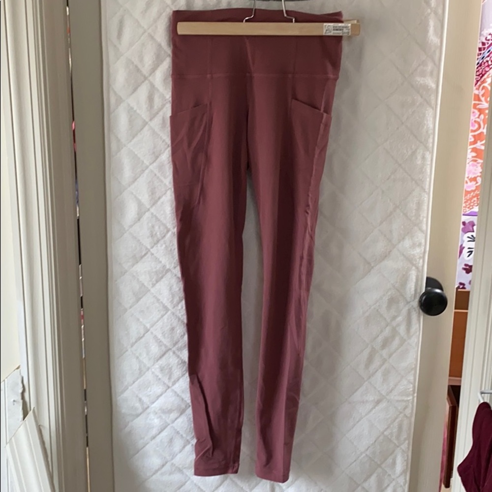 Athleta stash pocket salutation tight pant xxs